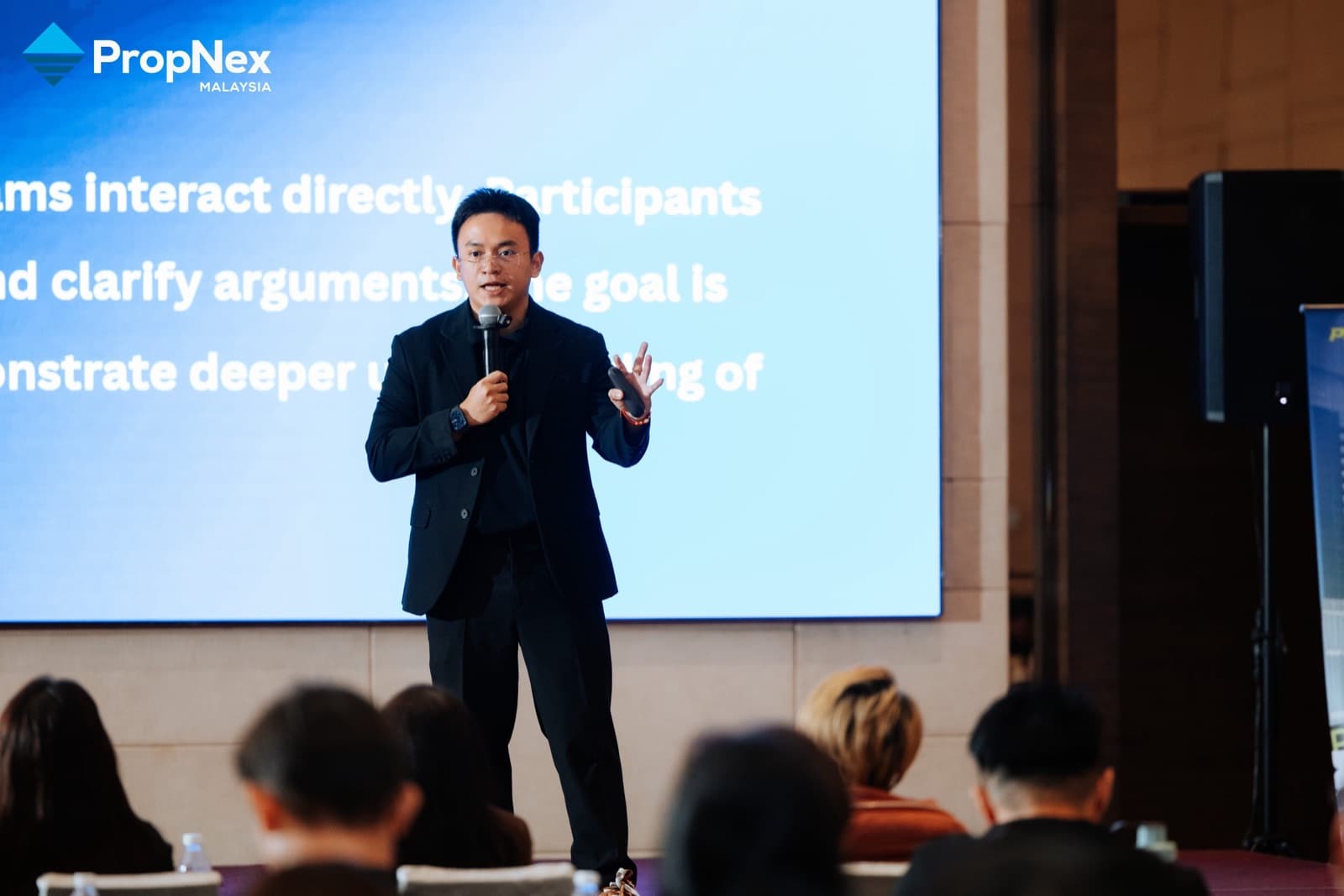 Jacob Ong speaking at PropNex Professional Project Training